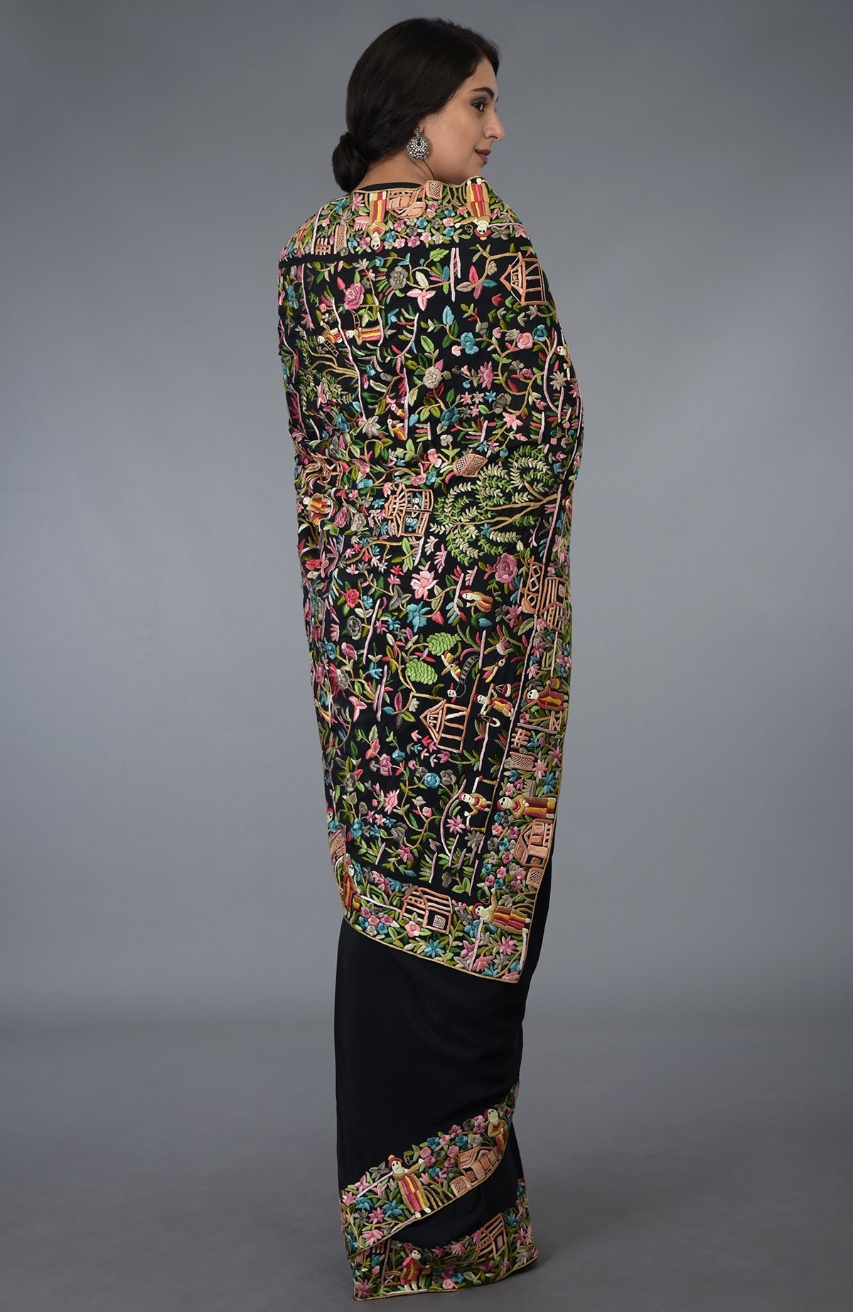 Black Parsi Gara hand-embroidered saree with vibrant floral and figural motifs.