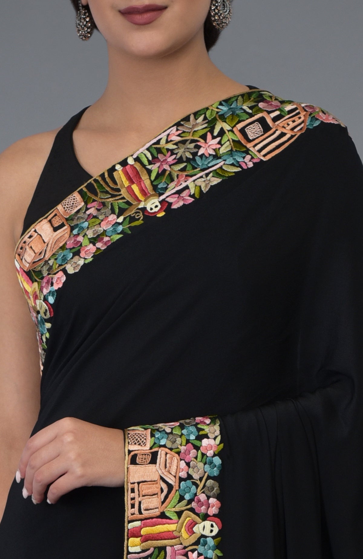 Black Parsi Gara hand-embroidered saree with colorful floral and figural patterns.