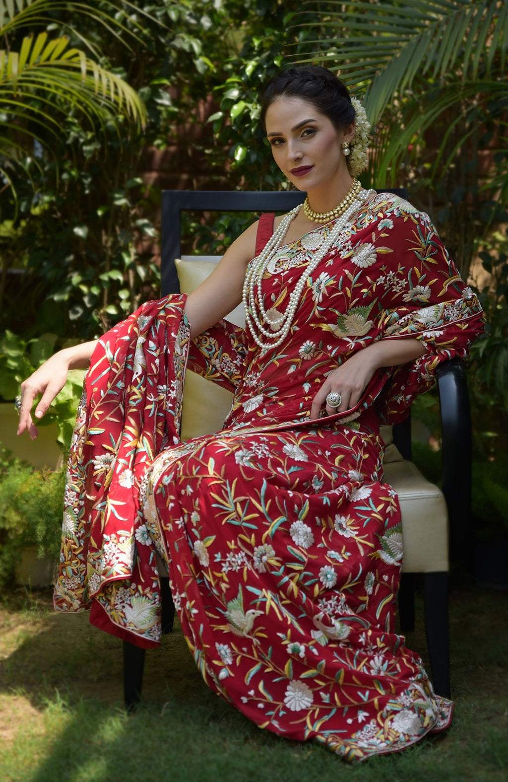 Red Parsi Gara hand-embroidered saree with birds and floral patterns.