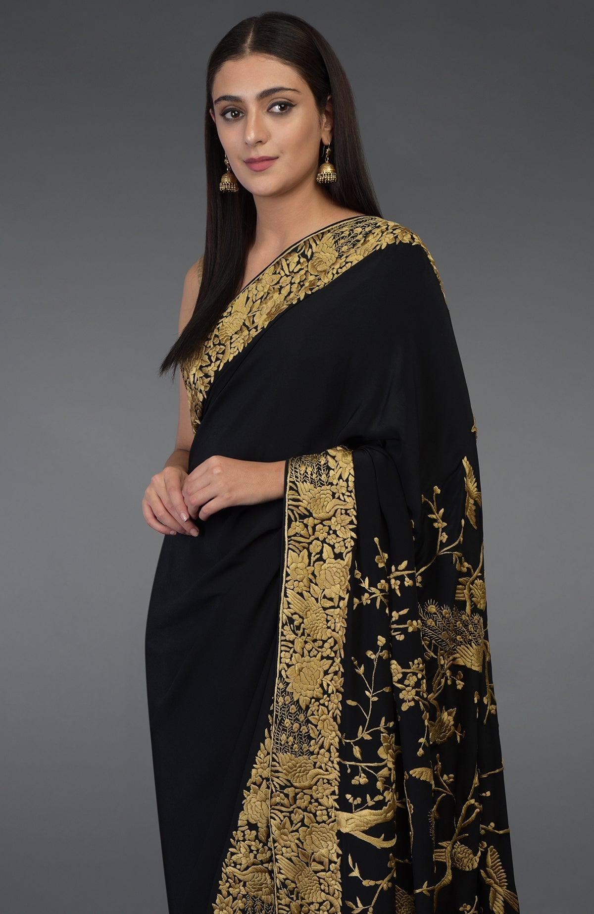 Black-beige gold Parsi Gara hand embroidered saree with floral and peacock-bird motifs.