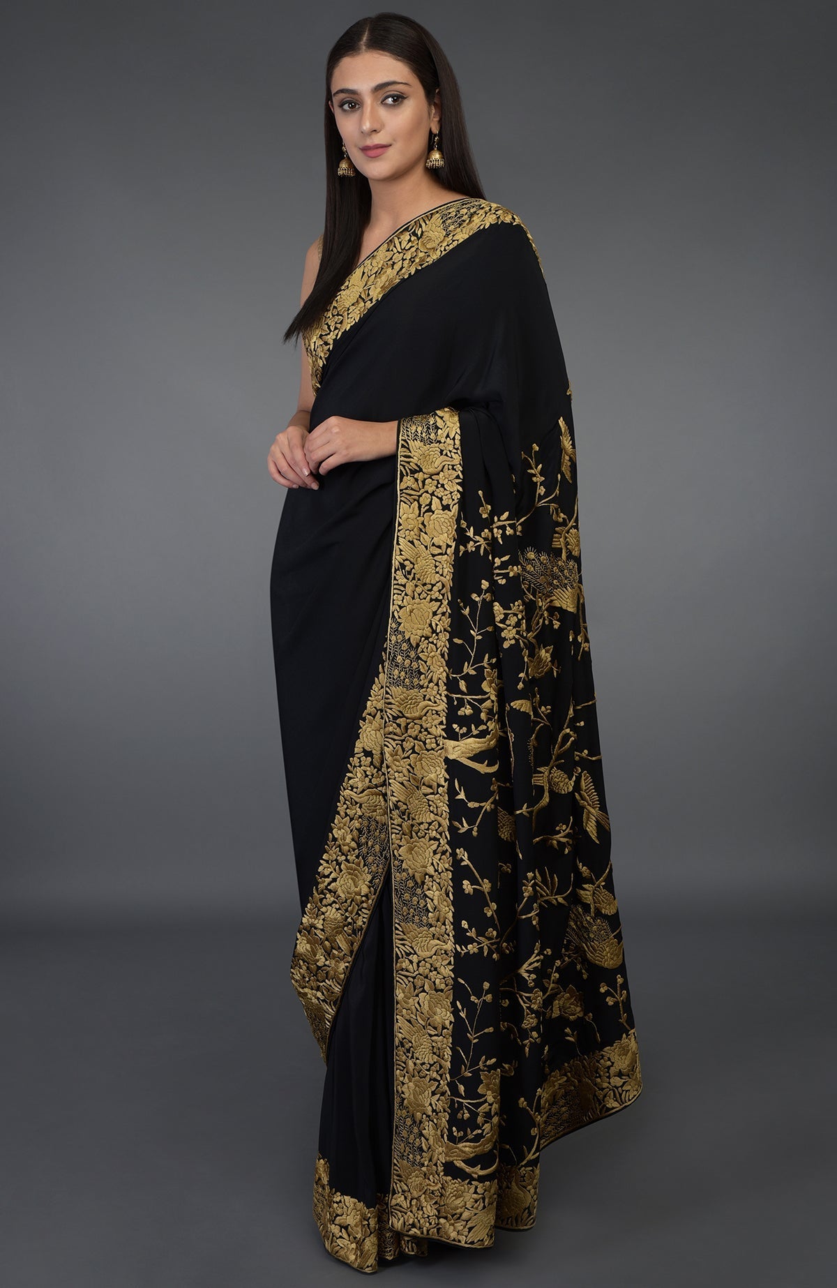 Black-beige gold Parsi Gara hand embroidered saree with floral and peacock-bird motifs.