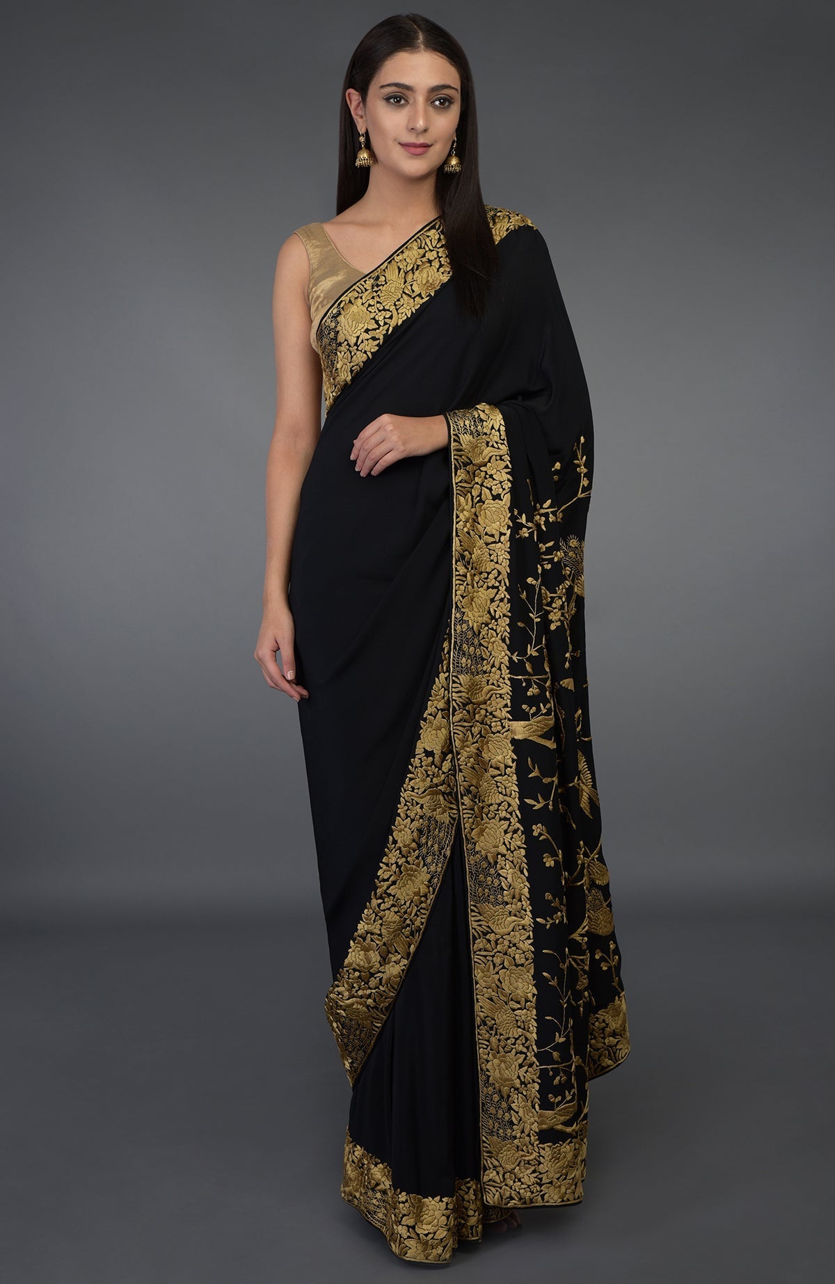 Black-beige gold Parsi Gara hand-embroidered saree with floral and peacock motifs.