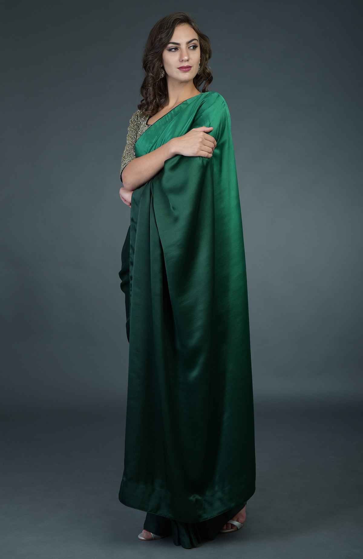 Bottle green ombre saree with zardozi work blouse.