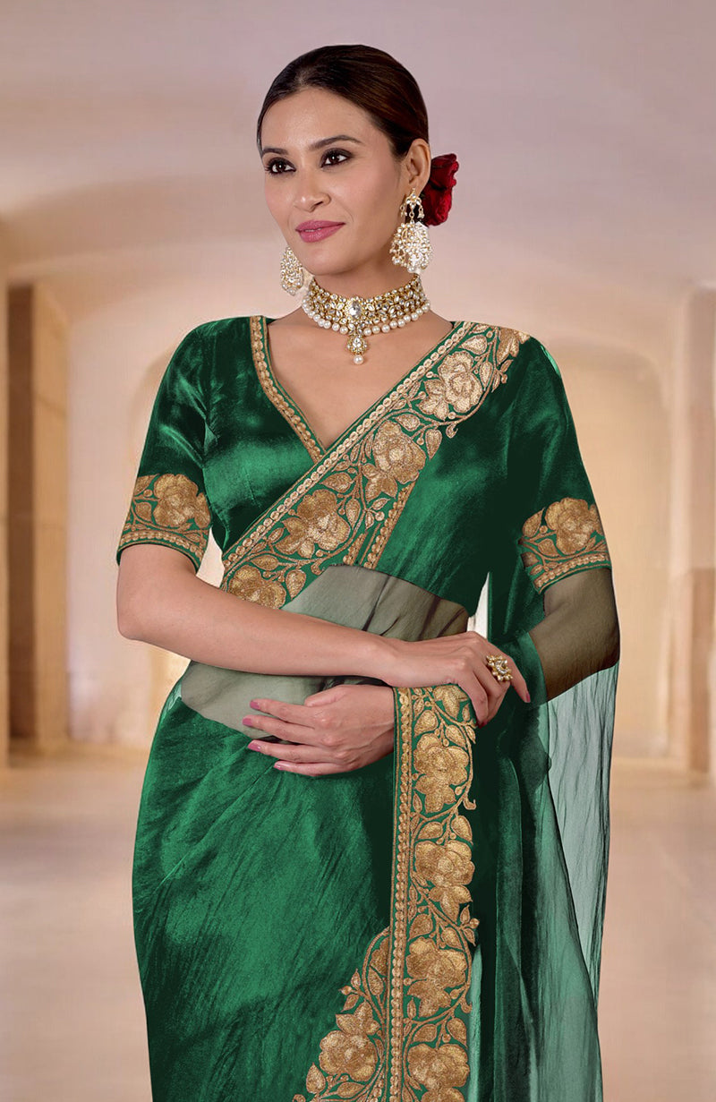 Emerald green Kashmiri Tilla embroidered saree with a matching blouse.