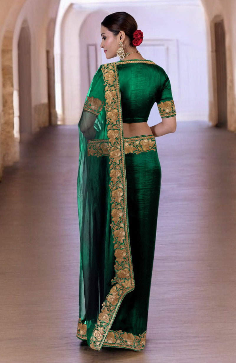 Emerald green Kashmiri Tilla embroidered saree with a matching blouse.