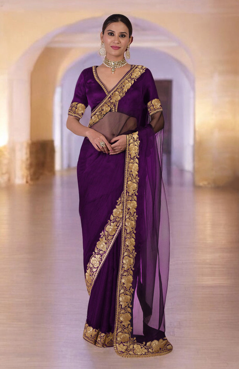 Plum Kashmiri Tilla embroidered saree with a matching blouse.