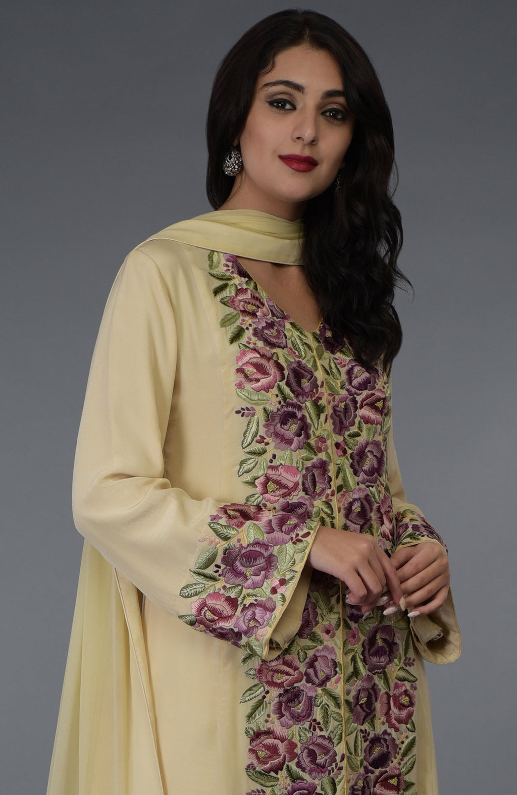 Lemon chiffon Parsi Gara embroidered suit with a woman modeling it.