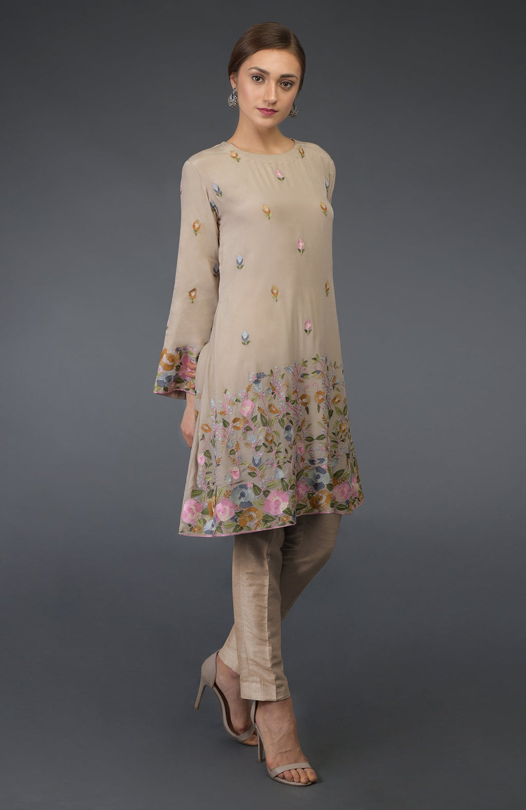 Beige Parsi embroidered tunic suit with floral embroidery and matching pants.