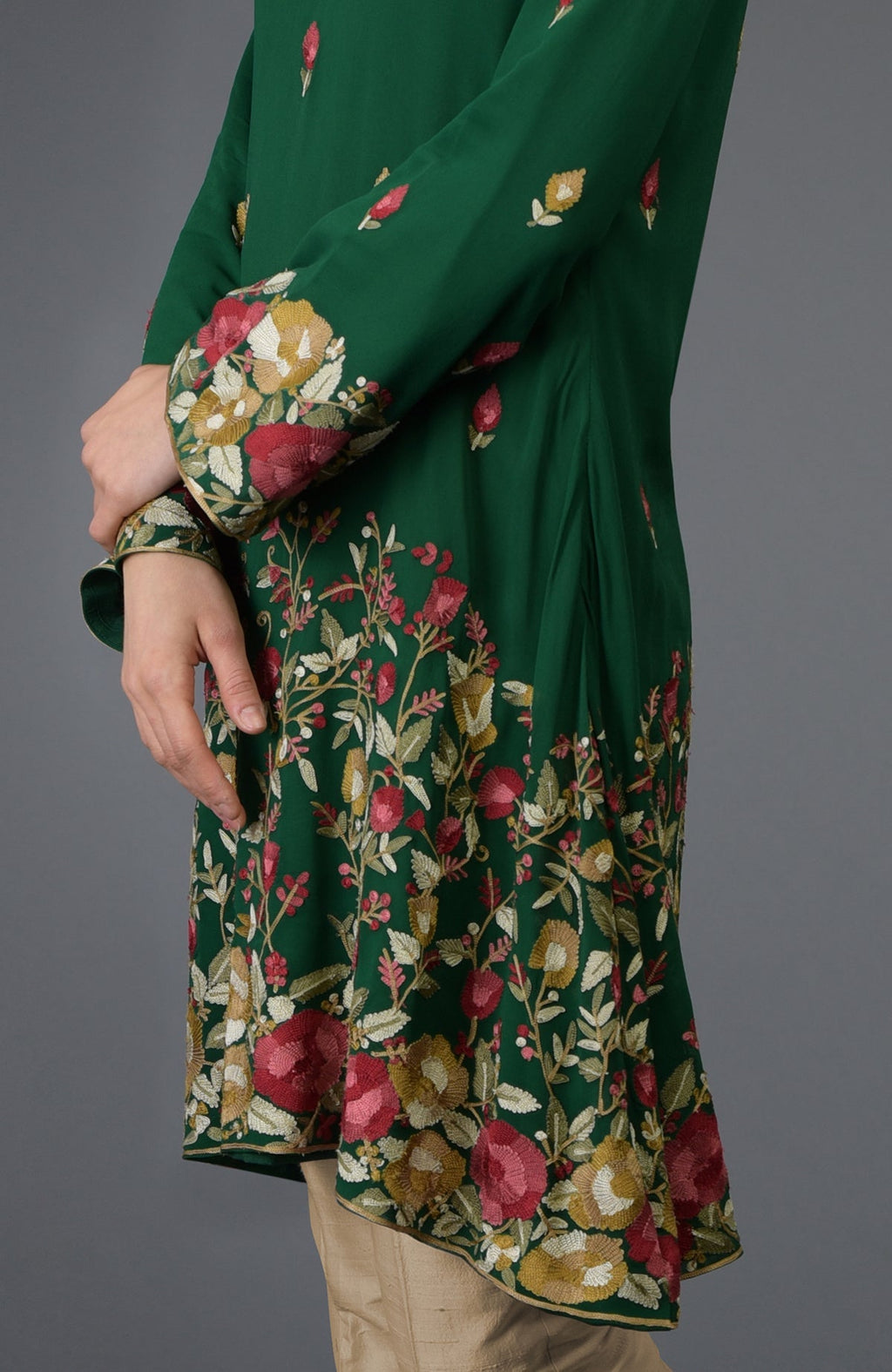 Bottle green tunic with Parsi floral embroidery and bell sleeves.