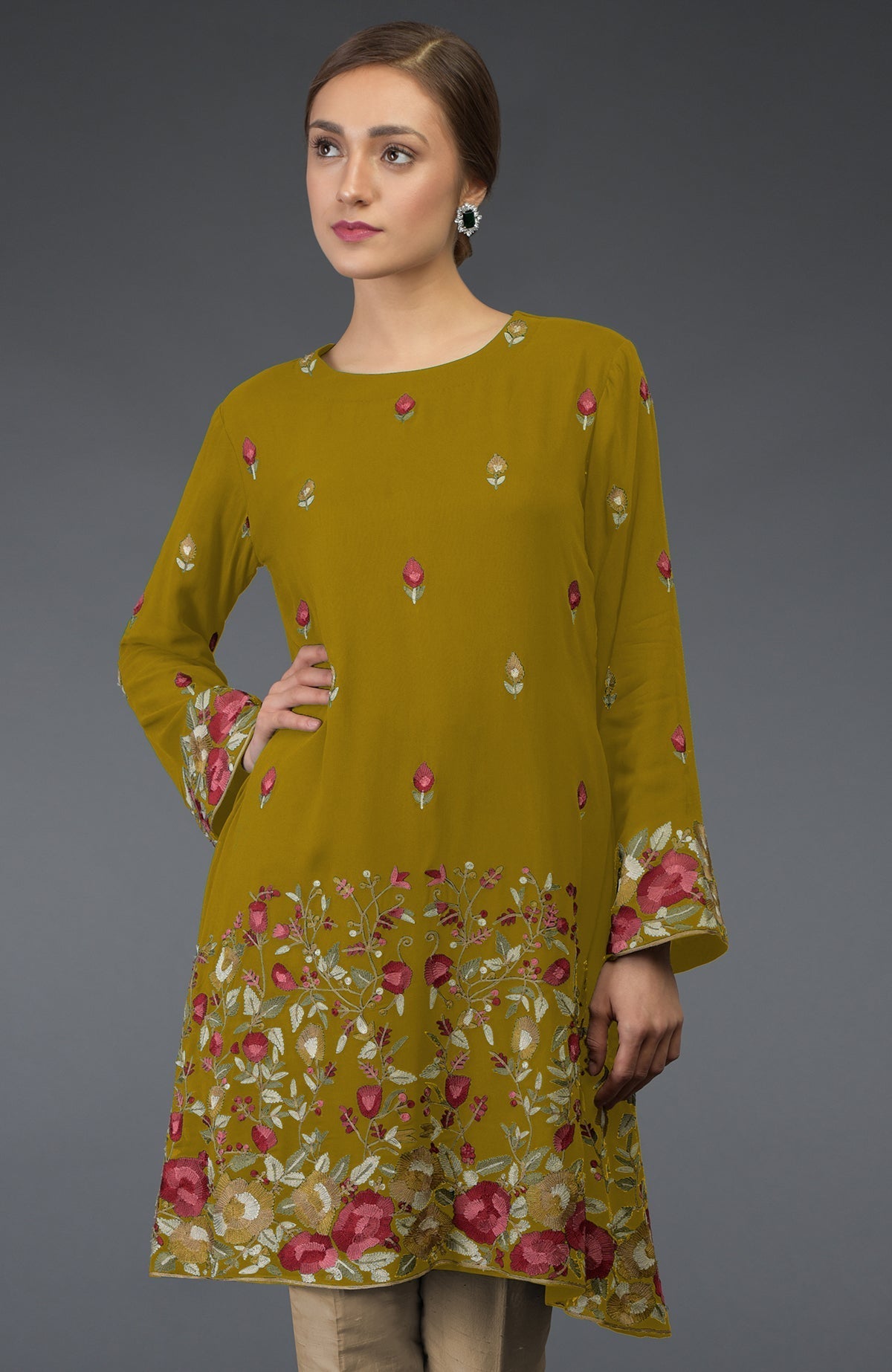 Mustard Parsi embroidered tunic suit with floral patterns and a model wearing it.