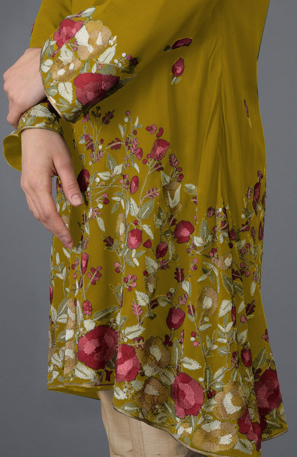 Mustard Parsi embroidered tunic with floral patterns and bell sleeves.