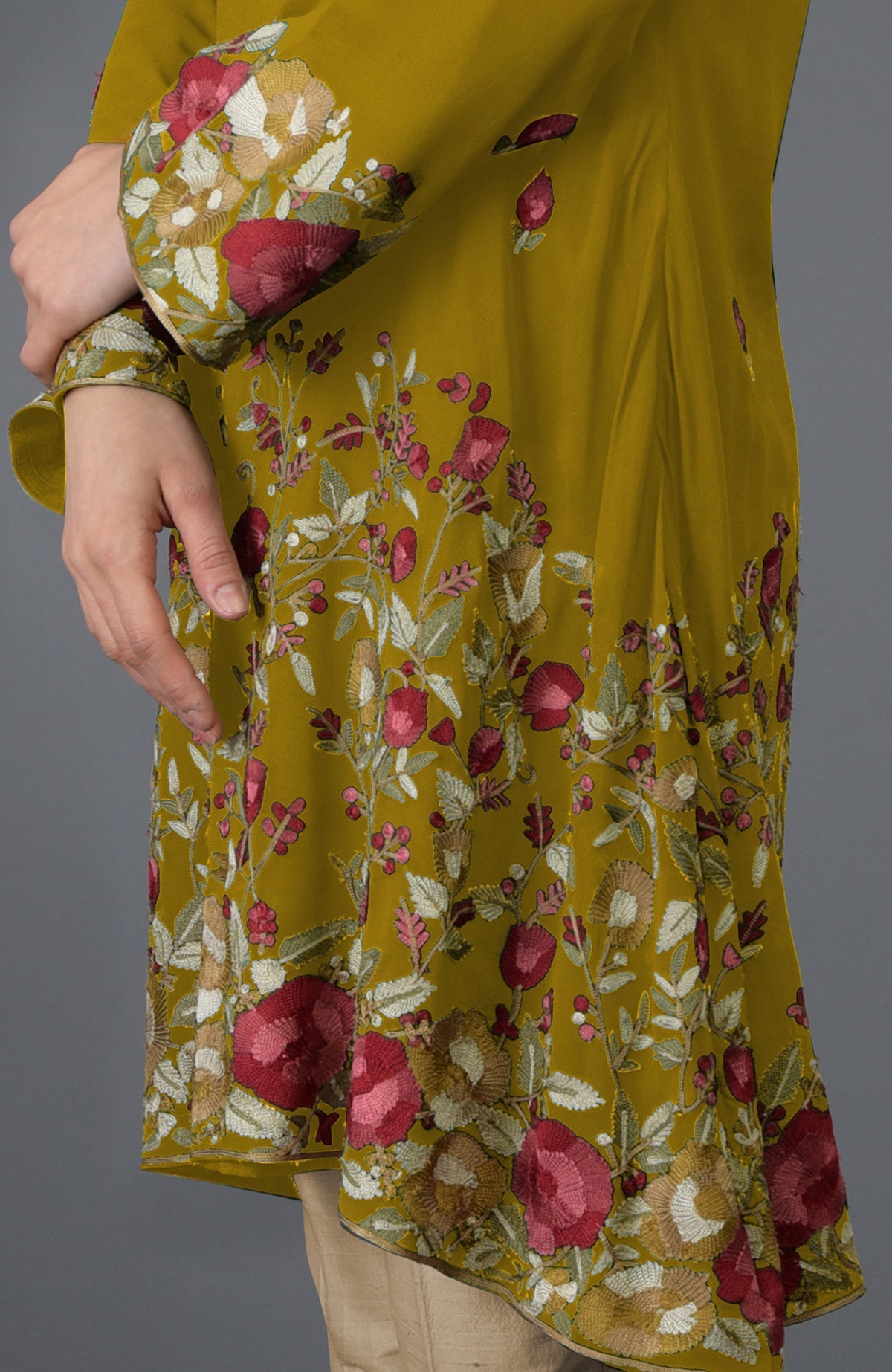 Mustard Parsi embroidered tunic with floral patterns and bell sleeves.