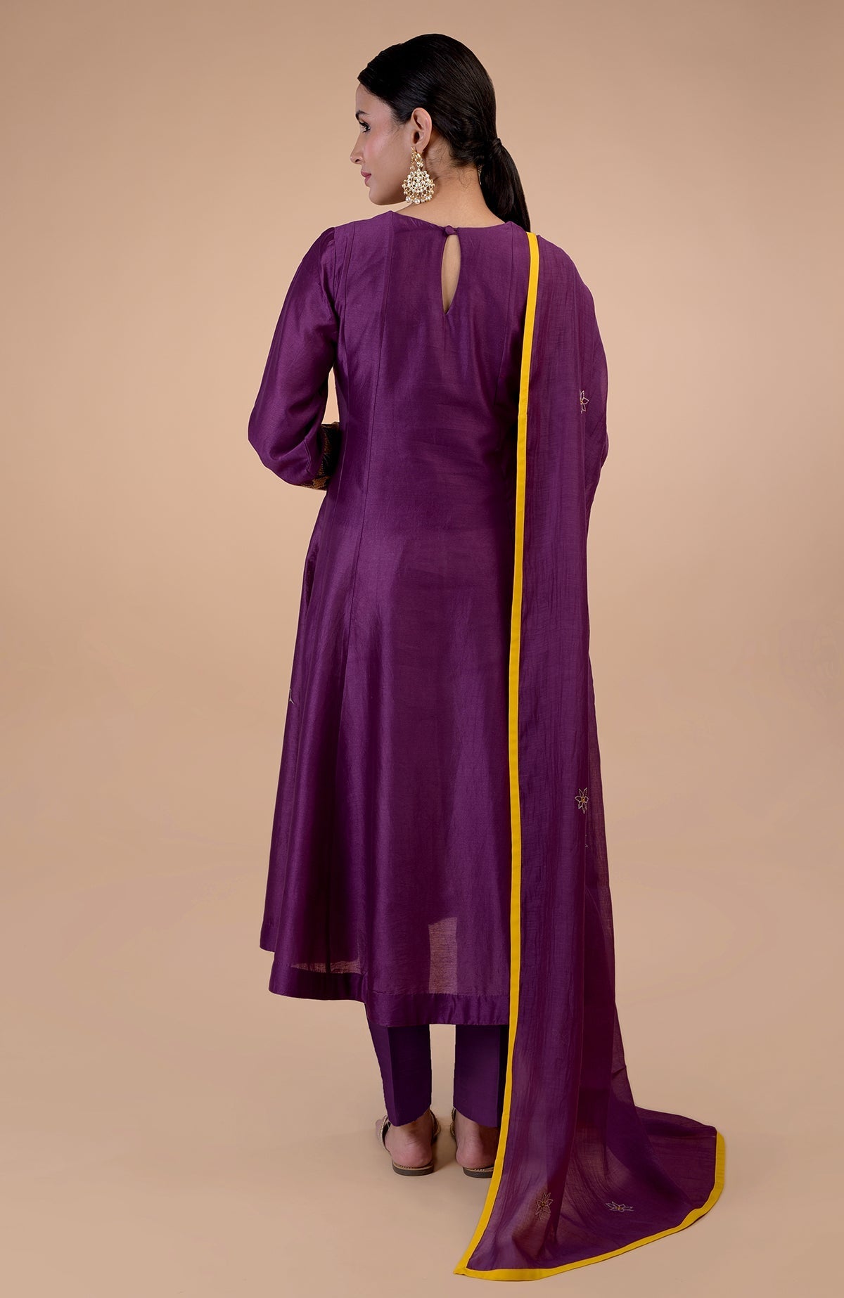 Plum Kantha hand embroidered kalidaar kurta set with mustard piping.