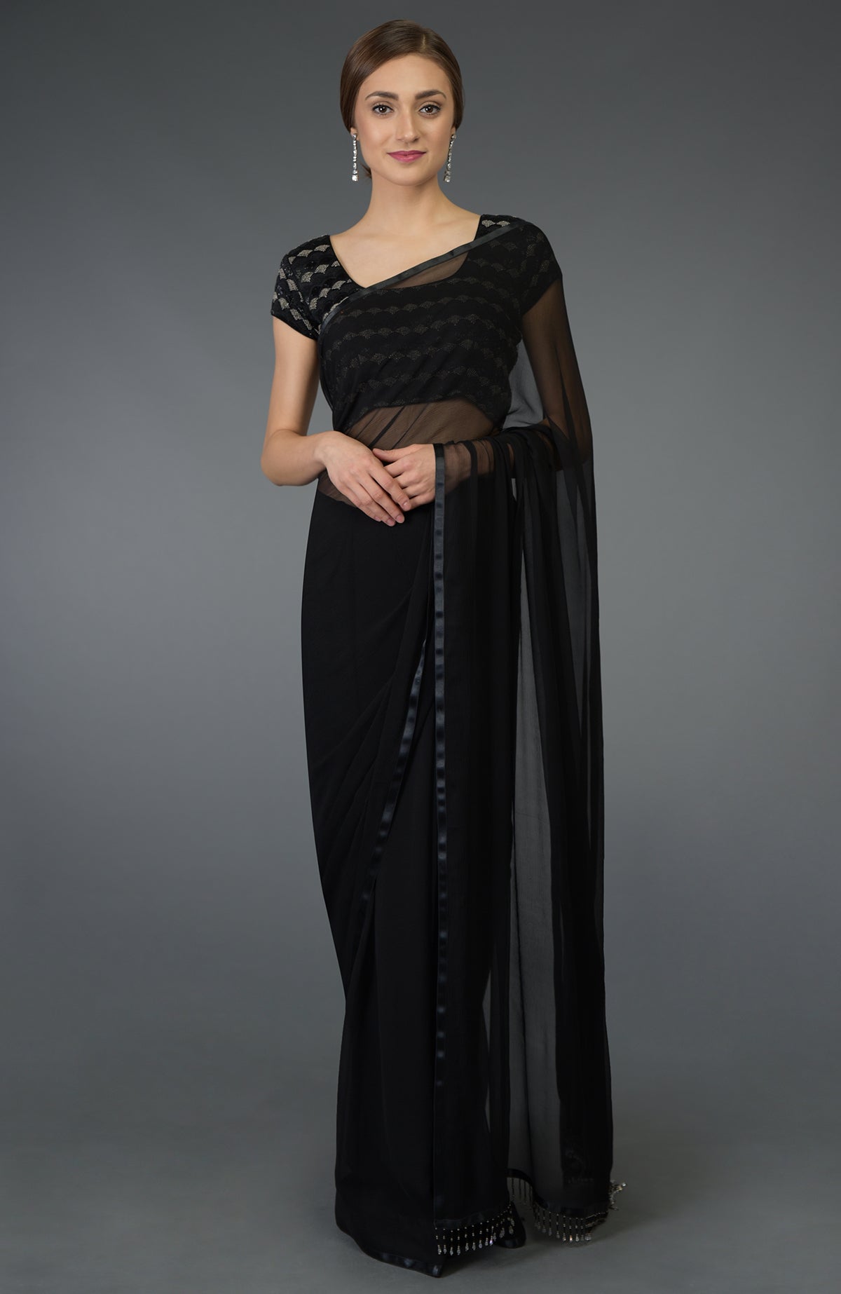Black pure chiffon saree with a zardozi and beads work blouse.