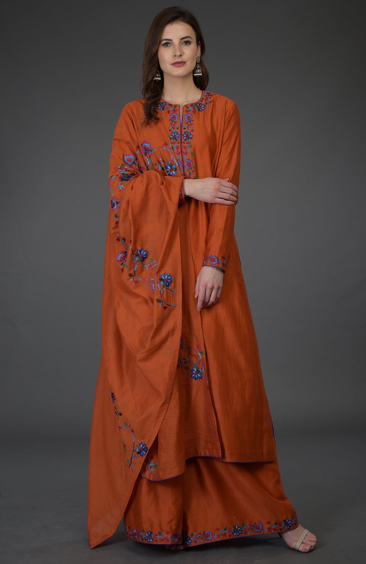 Burnt orange palazzo suit with Kashmir Bagh-inspired floral embroidery.