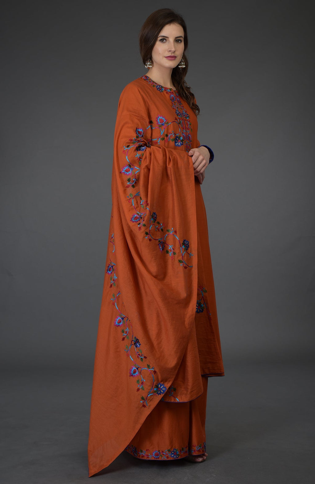 Burnt orange Kashmir Bagh inspired Farshi Palazzo Suit with floral embroidery.