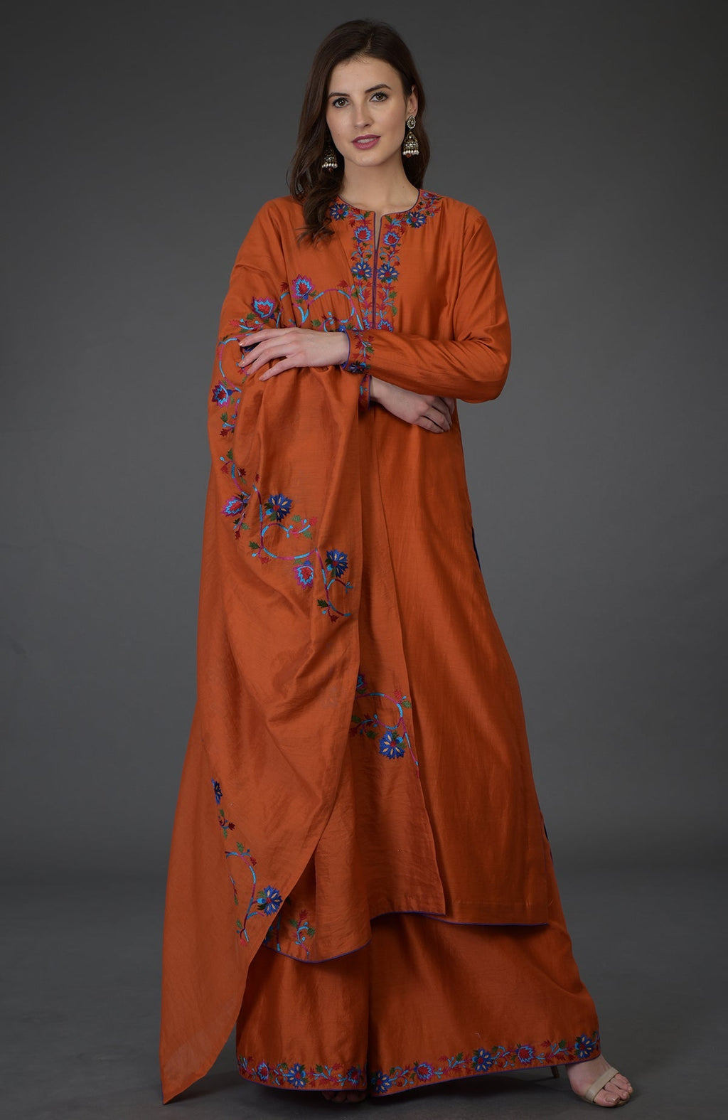 Burnt orange Kashmir Bagh inspired Farshi Palazzo Suit with floral embroidery.