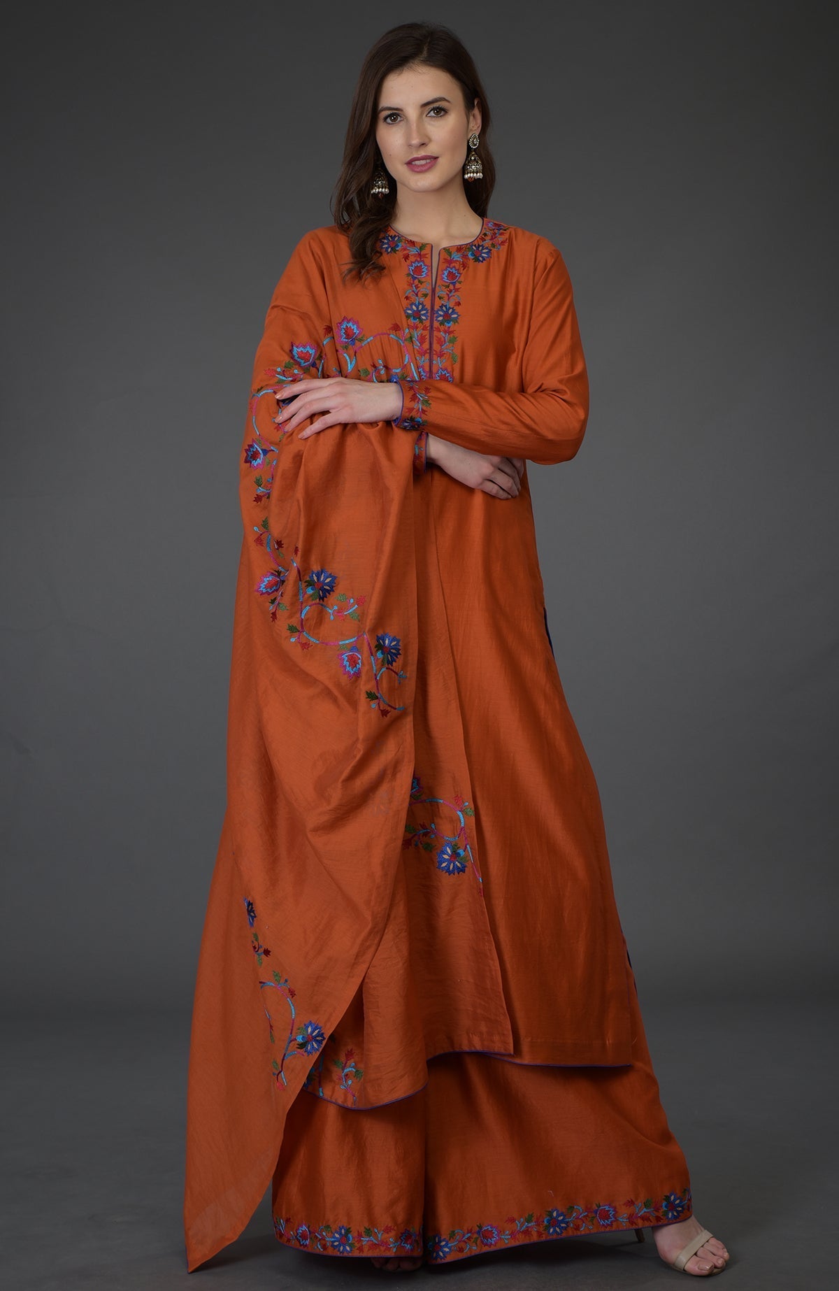 Burnt orange Kashmir Bagh inspired Farshi Palazzo Suit with floral embroidery.