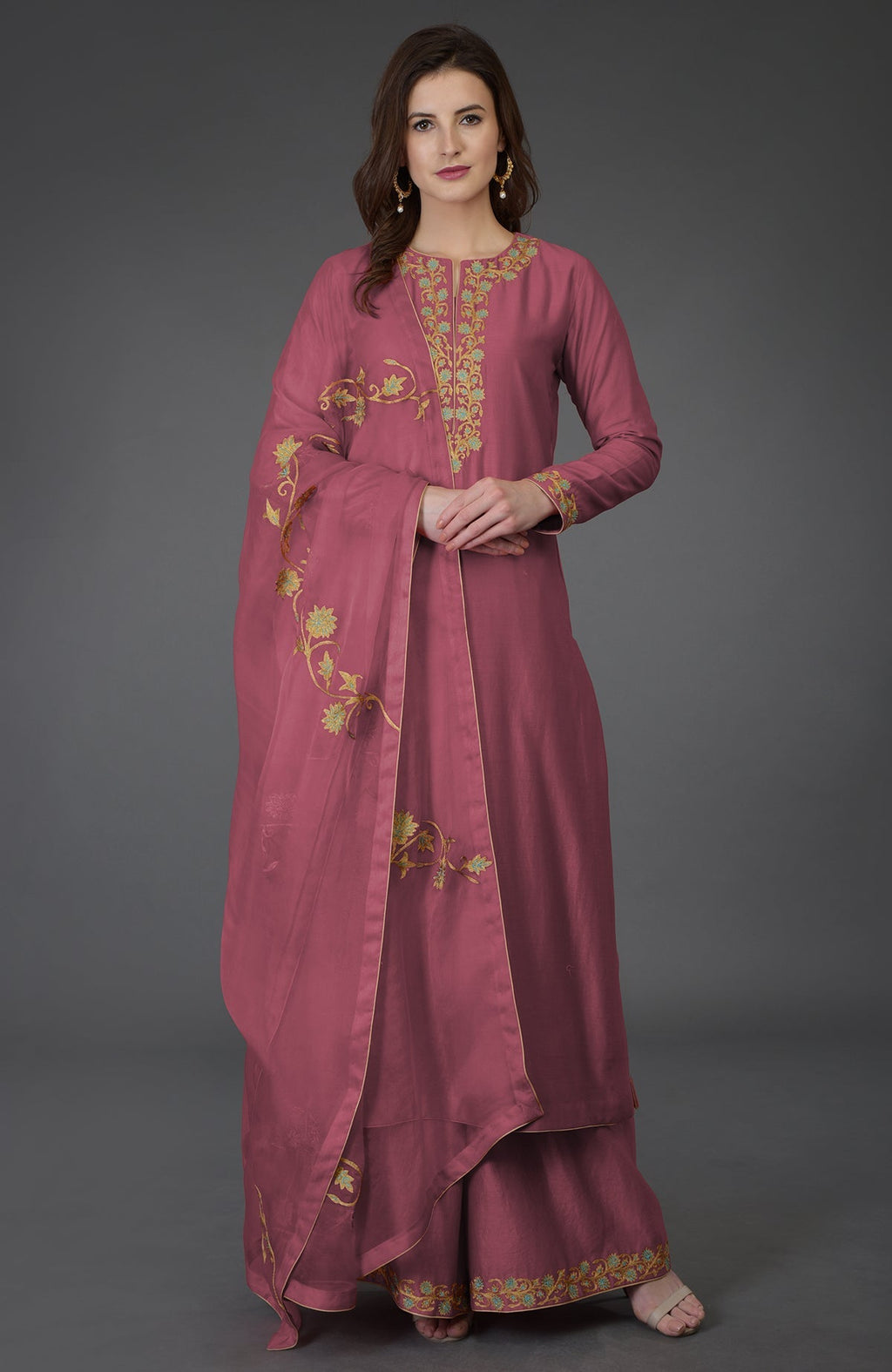 A woman models a chutney resham-tilla embroidered farshi palazzo suit.