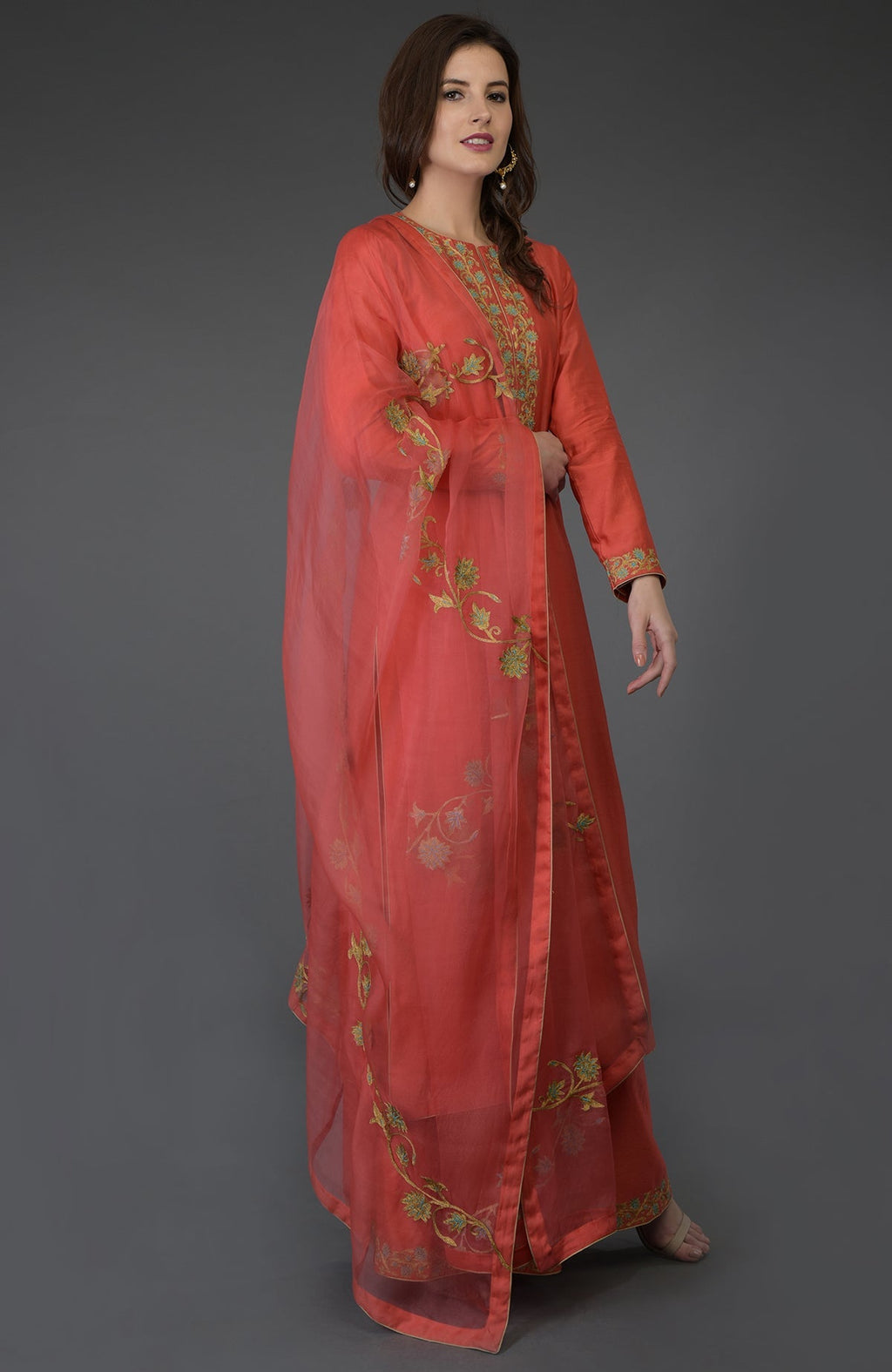 Living coral resham-tilla embroidered farshi palazzo suit with a matching dupatta.