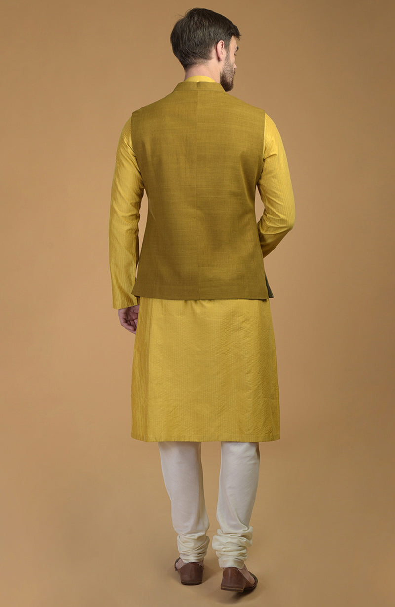 Mango Mojito Anarkali with rose gold embroidery paired with Sunglow pintuck kurta and mustard waistcoat set