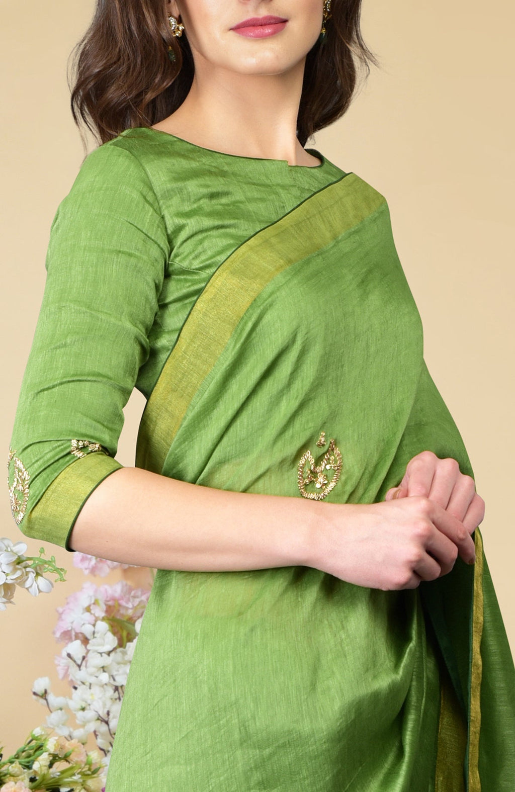 Pepper stem linen saree with zardozi embroidery and zari weave borders.