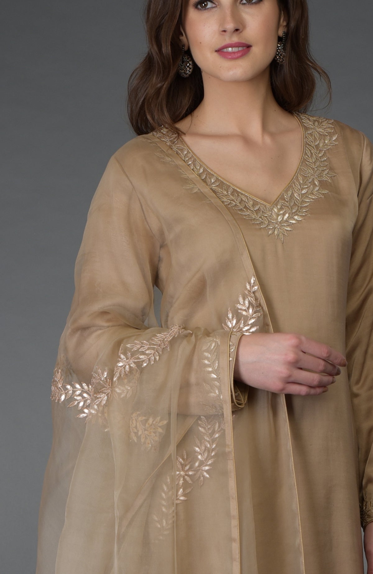 Beige Gota Patti Work Farshi Palazzo Suit with a V-neck and embroidered dupatta.
