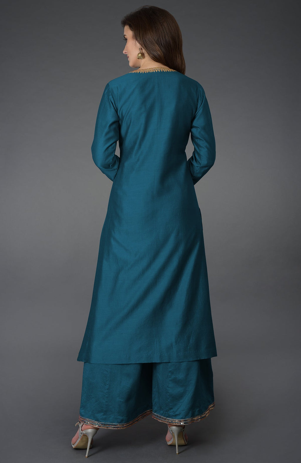 Peacock blue marori and sequin work farshi palazzo suit on a model.
