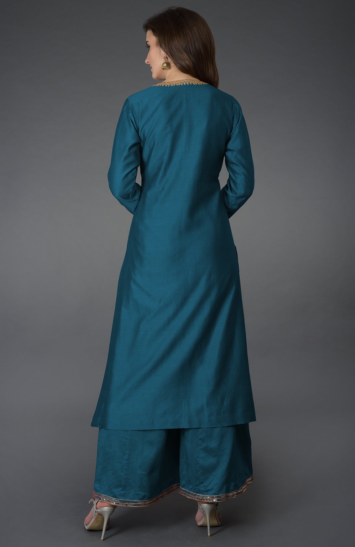 Peacock blue marori and sequin work farshi palazzo suit on a model.
