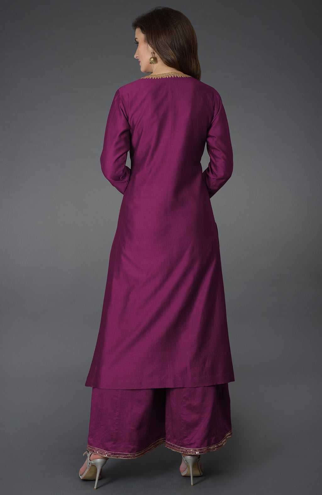 A woman from behind wears a peacock pink marori and sequin work farshi palazzo suit.
