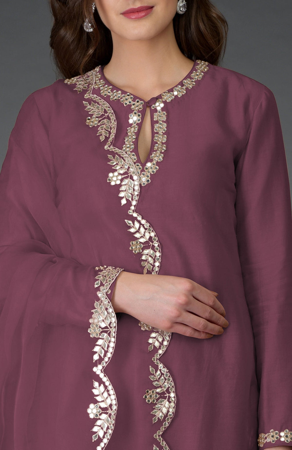 Burgundy purple suit with intricate gota patti and mirror work embroidery.