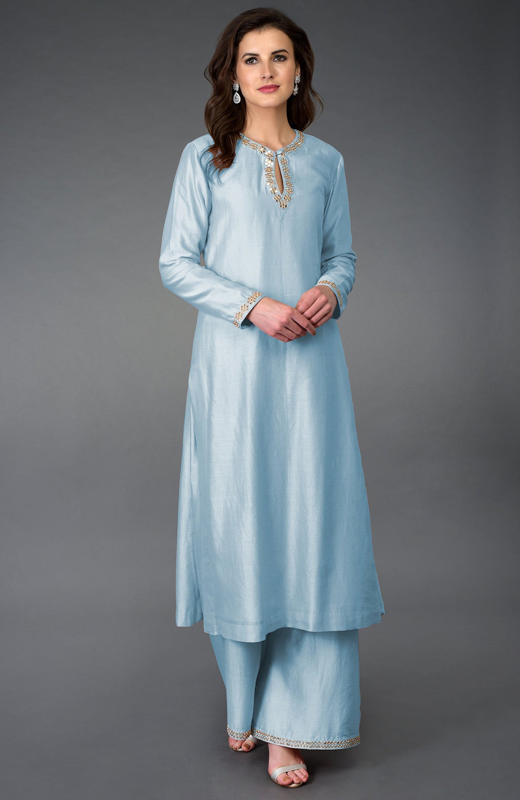 A woman models a Winter Sky Gota Patti and Mirror Work Farshi Palazzo Suit.