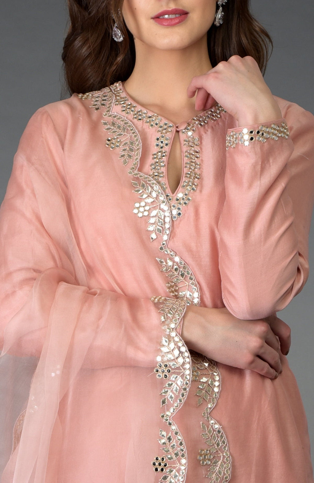 Pressed rose farshi palazzo suit with mirror and zari work and gota patti embroidery.