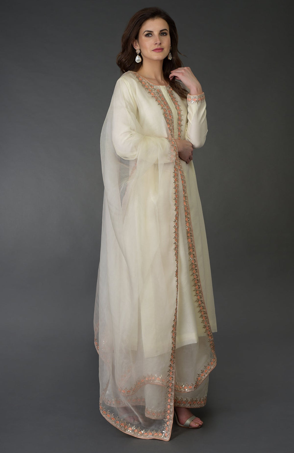 An ivory resham gota patti and pearl beads farshi palazzo suit.