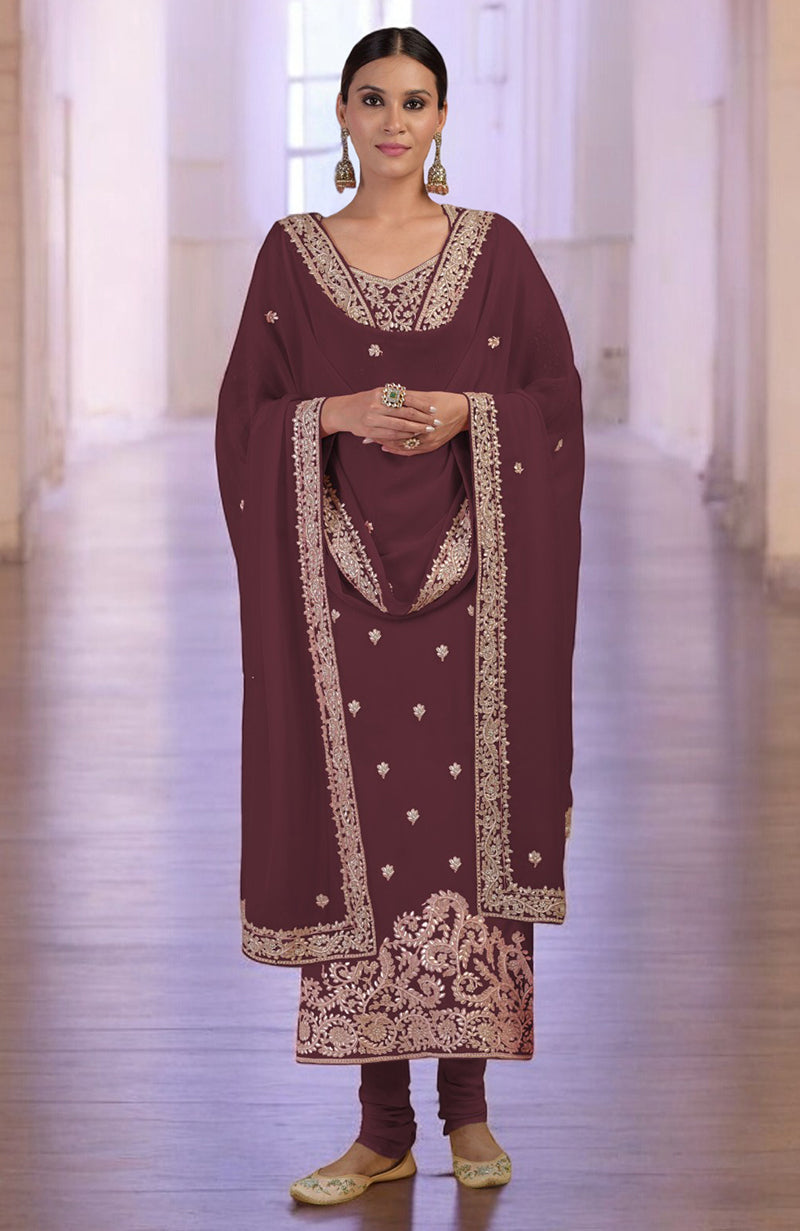 Burgundy kurta set with rose gold embroidery, churidar, and matching dupatta.