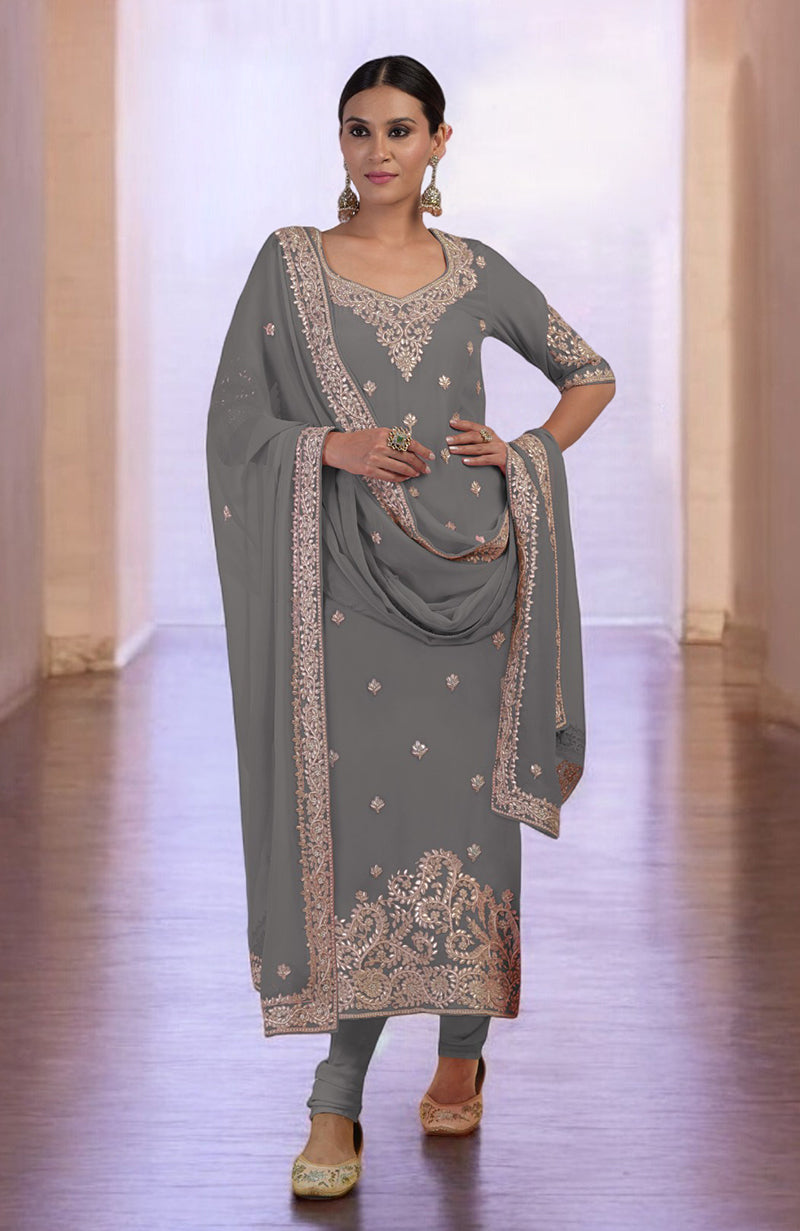 Grey kurta set with rose gold embroidery, churidar, and dupatta.