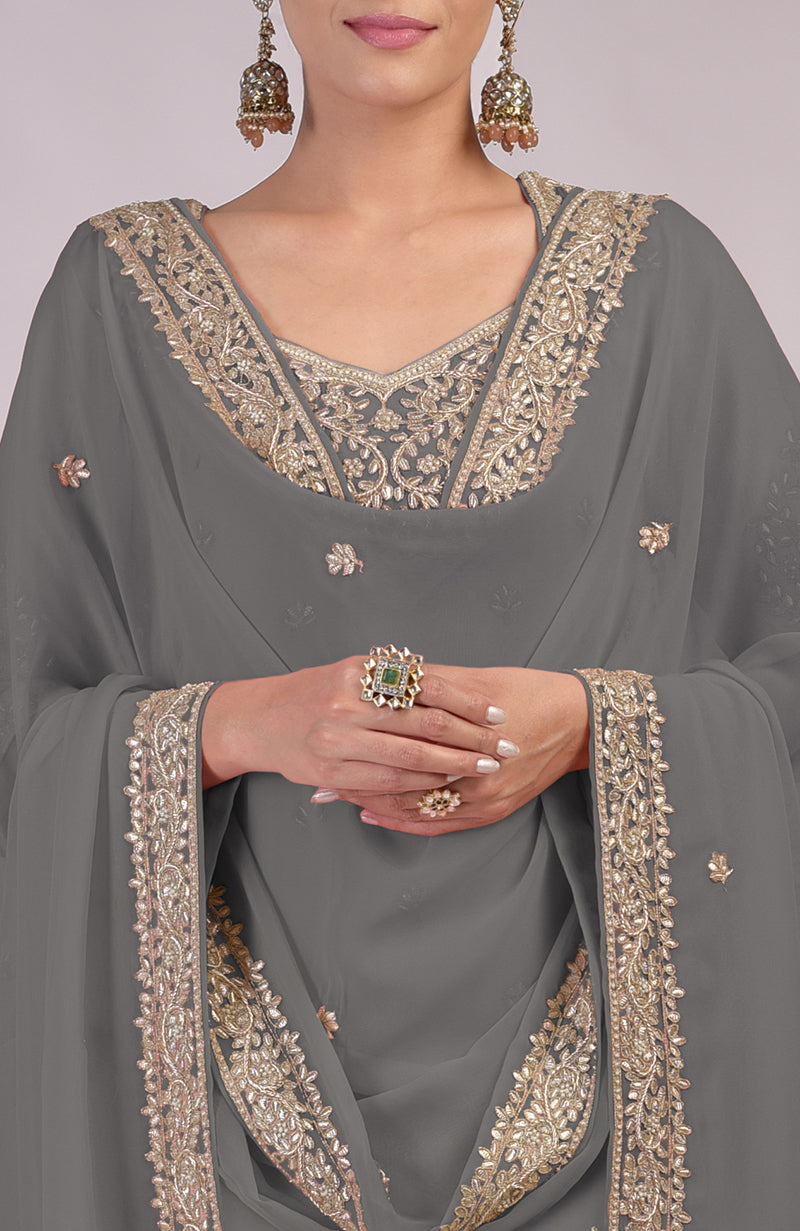 Grey kurta set with intricate rose gold embroidery and a matching dupatta.