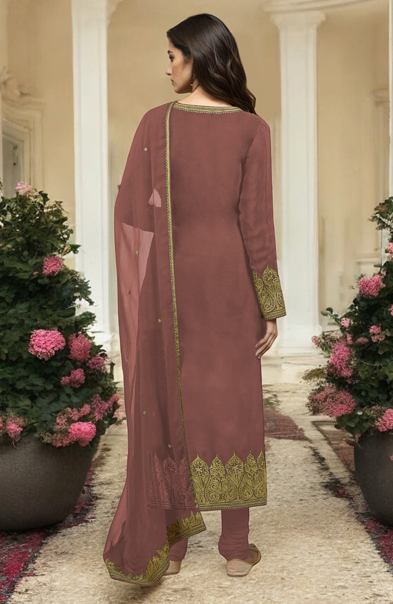 A woman models a chutney gold Kashmiri tilla aari embroidered kurta set.