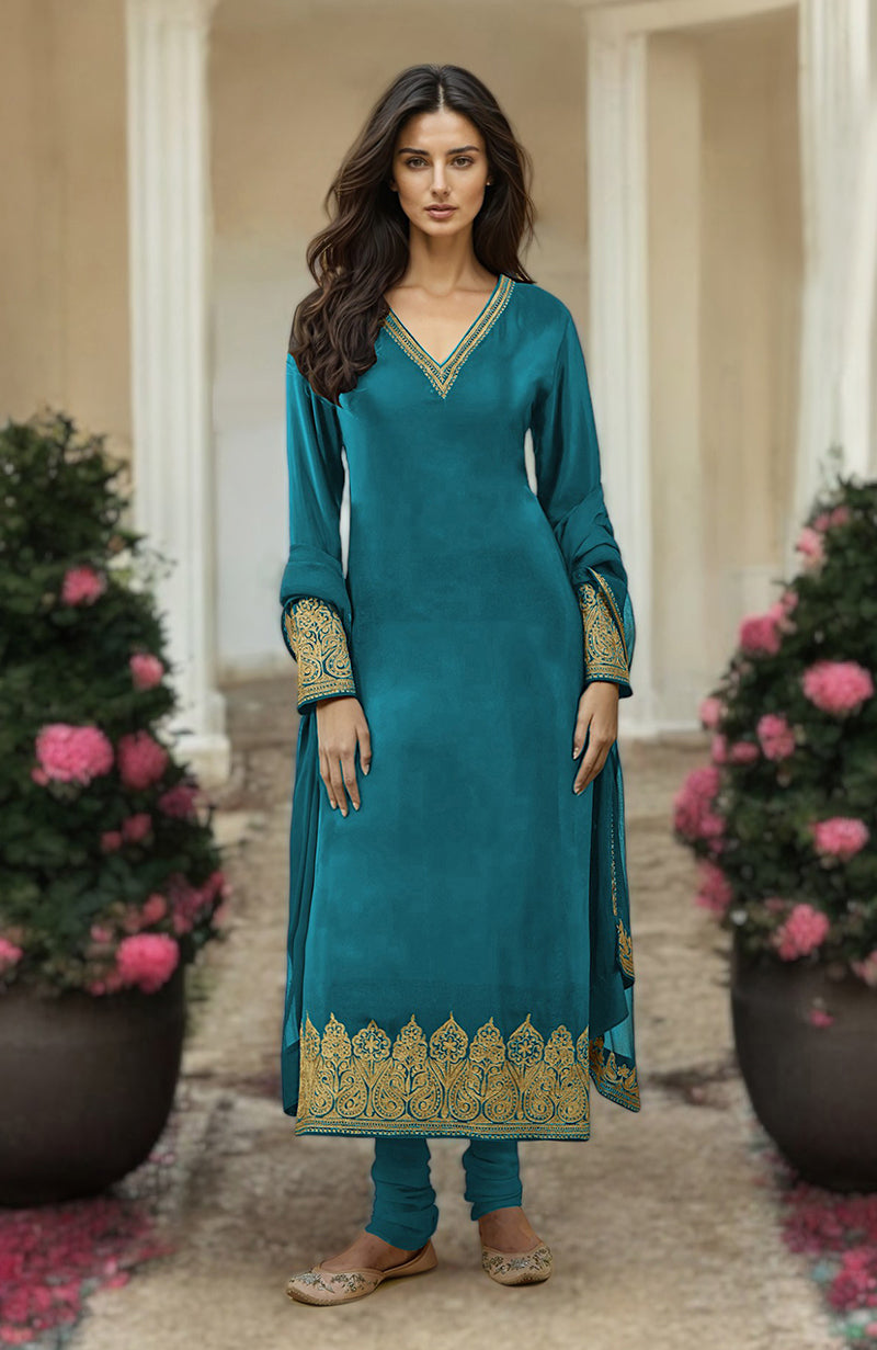 Peacock blue kurta set with gold Kashmiri tilla aari embroidery on the neckline, sleeves, and hem.