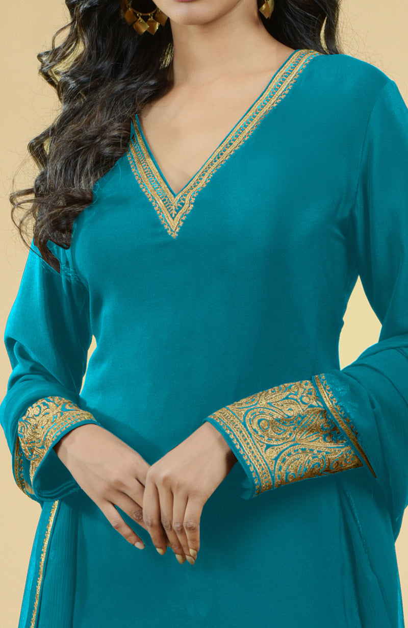 Peacock blue kurta set with gold Kashmiri tilla aari embroidery on the neckline and sleeves.