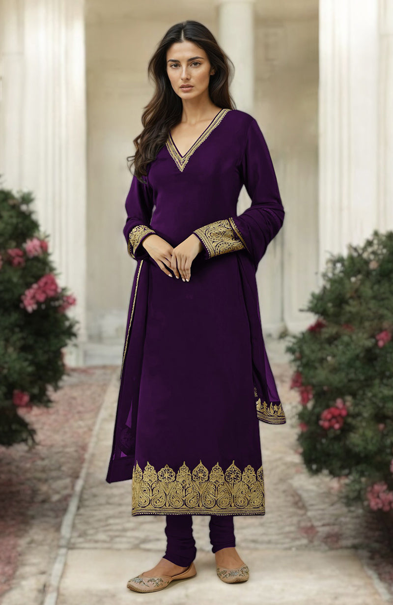 A woman models a purple kurta set with gold Kashmiri tilla aari embroidery.