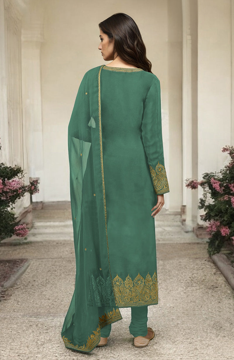 A woman models a jade green kurta set with gold Kashmiri tilla aari embroidery.