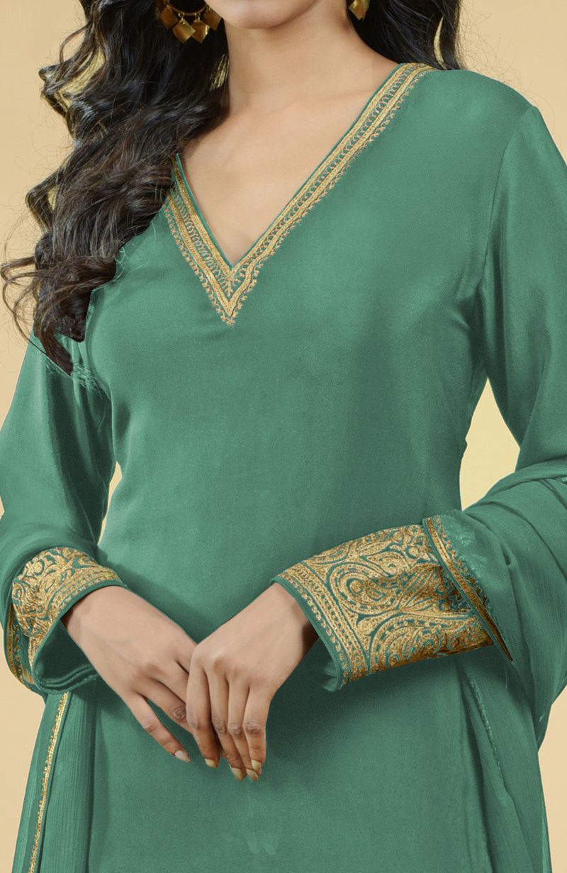 Jade green kurta set with gold Kashmiri tilla aari embroidery on the neckline and sleeves.