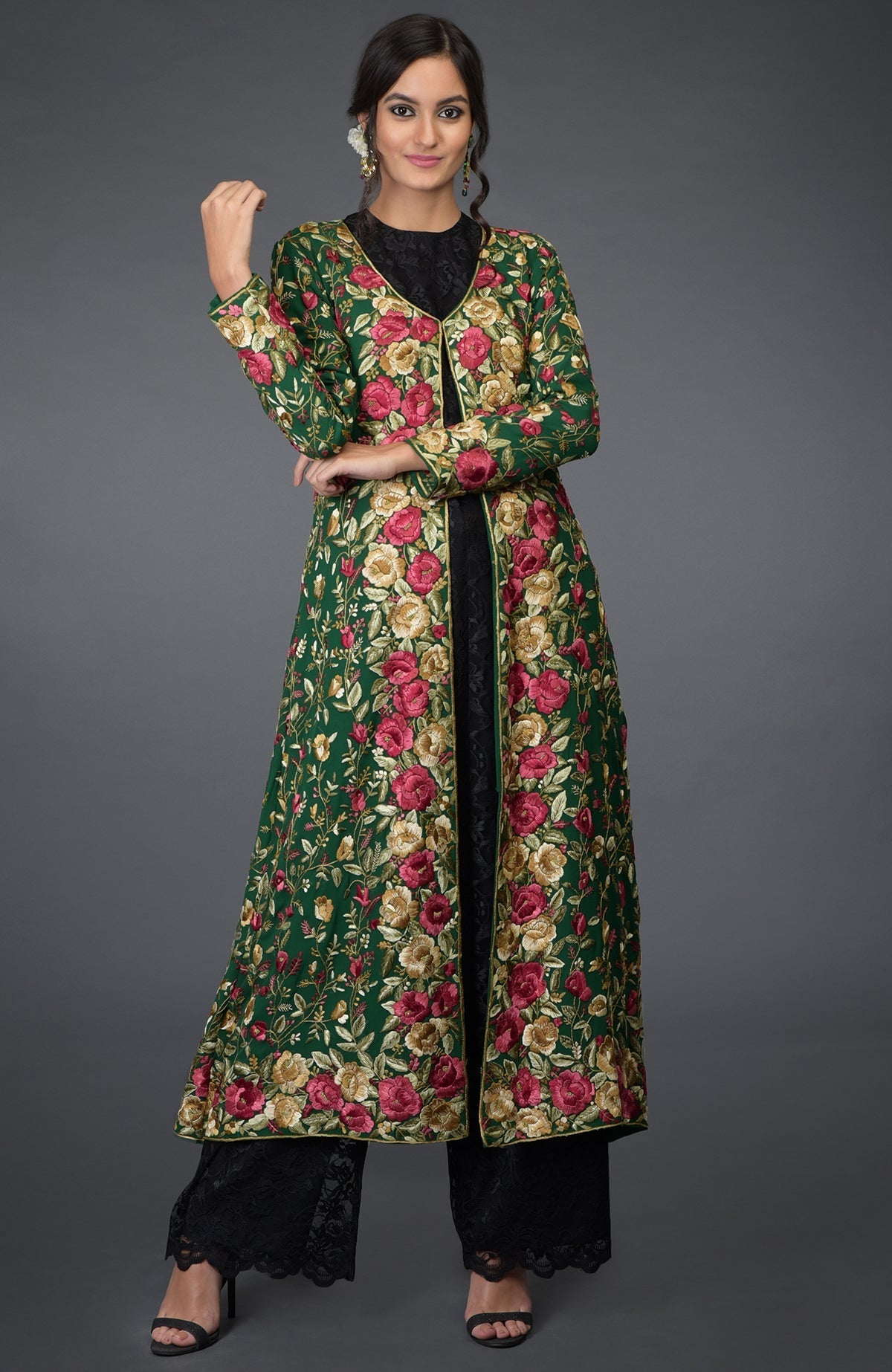 Emerald green georgette jacket with Parsi Gara floral embroidery and beige crepe skirt.