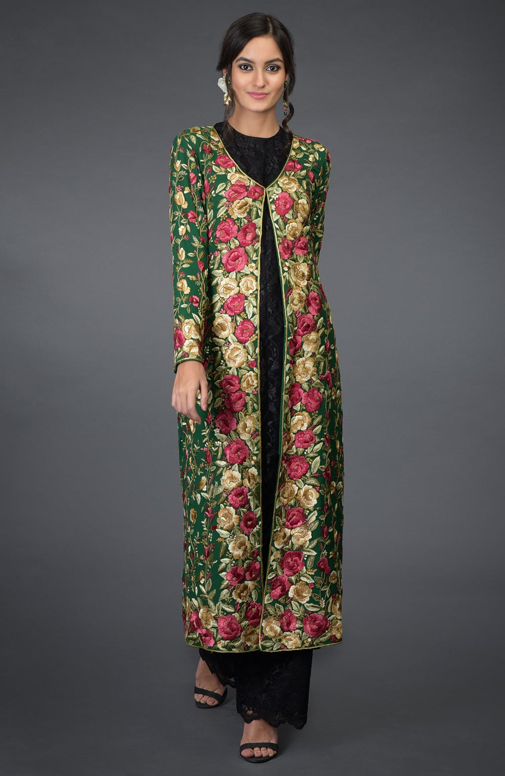 Emerald green georgette jacket with multicolor Parsi Gara floral embroidery and beige crepe skirt.