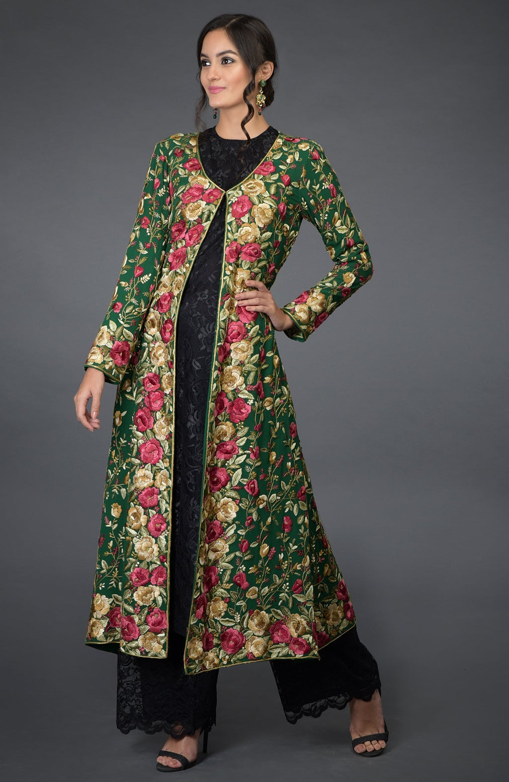 Emerald green georgette jacket with multicolor Parsi Gara floral embroidery and beige flared skirt.