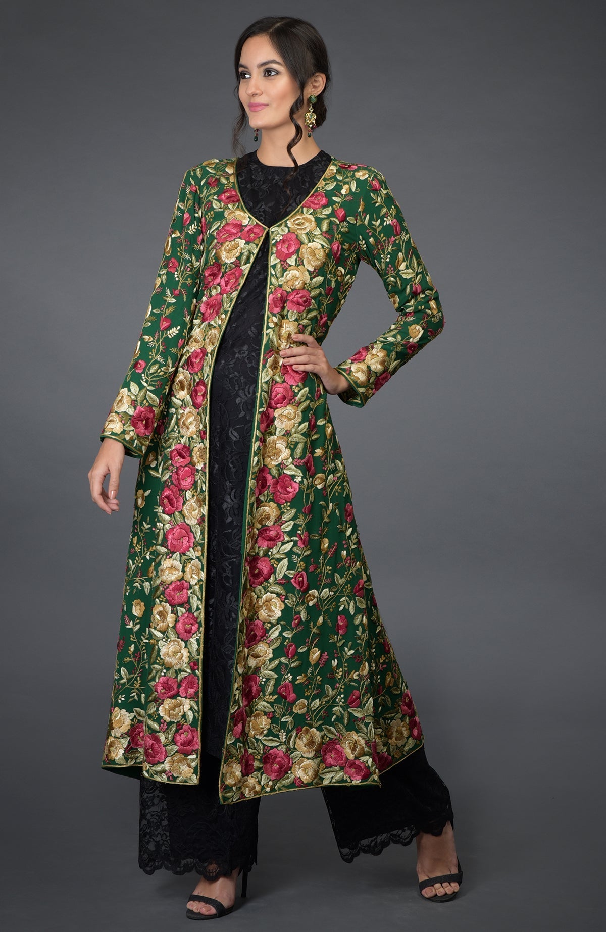 Emerald green georgette jacket with multicolor Parsi Gara floral embroidery and beige flared skirt.