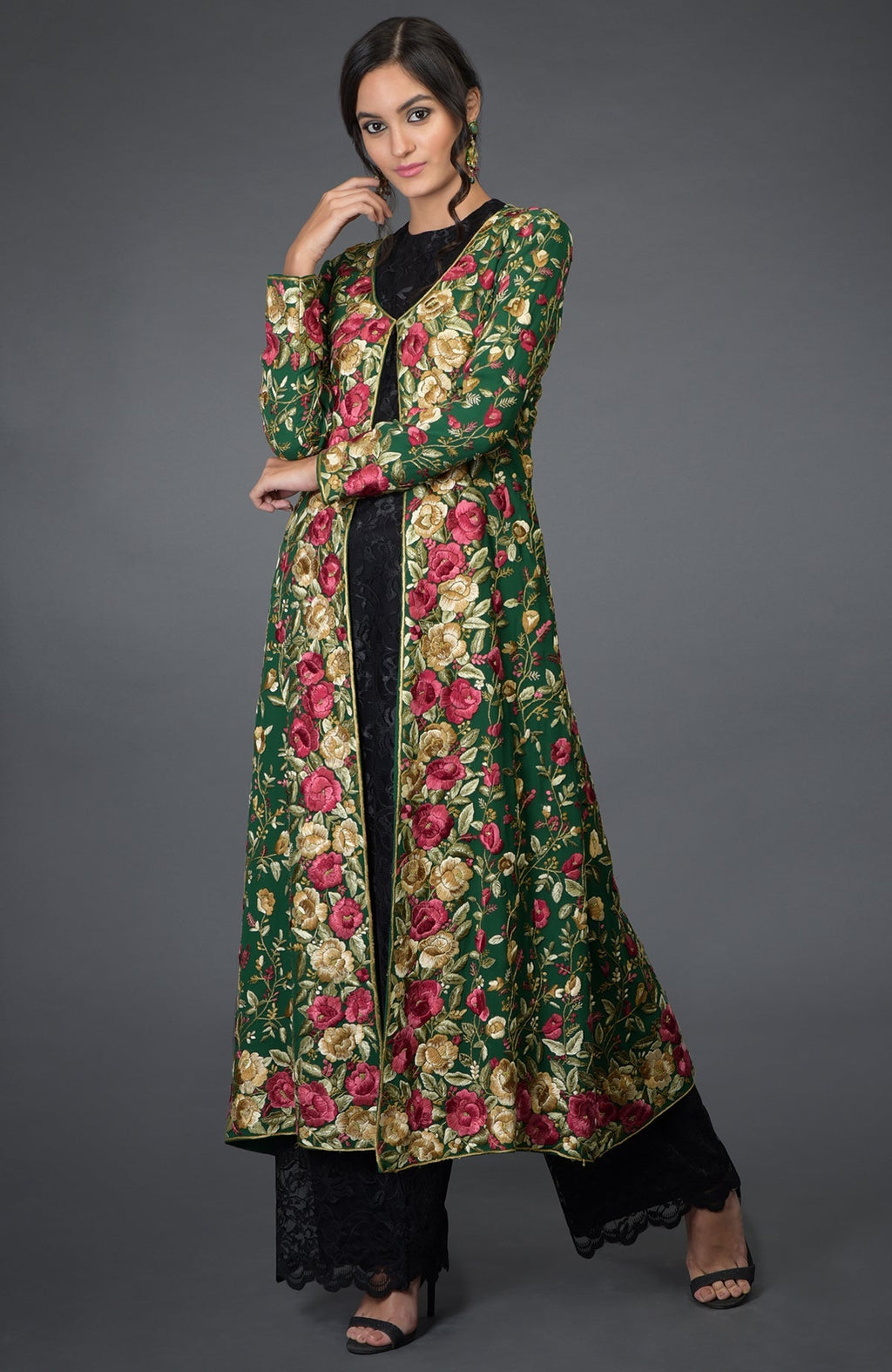 Emerald green georgette jacket with Parsi Gara floral embroidery and beige crepe flared skirt.