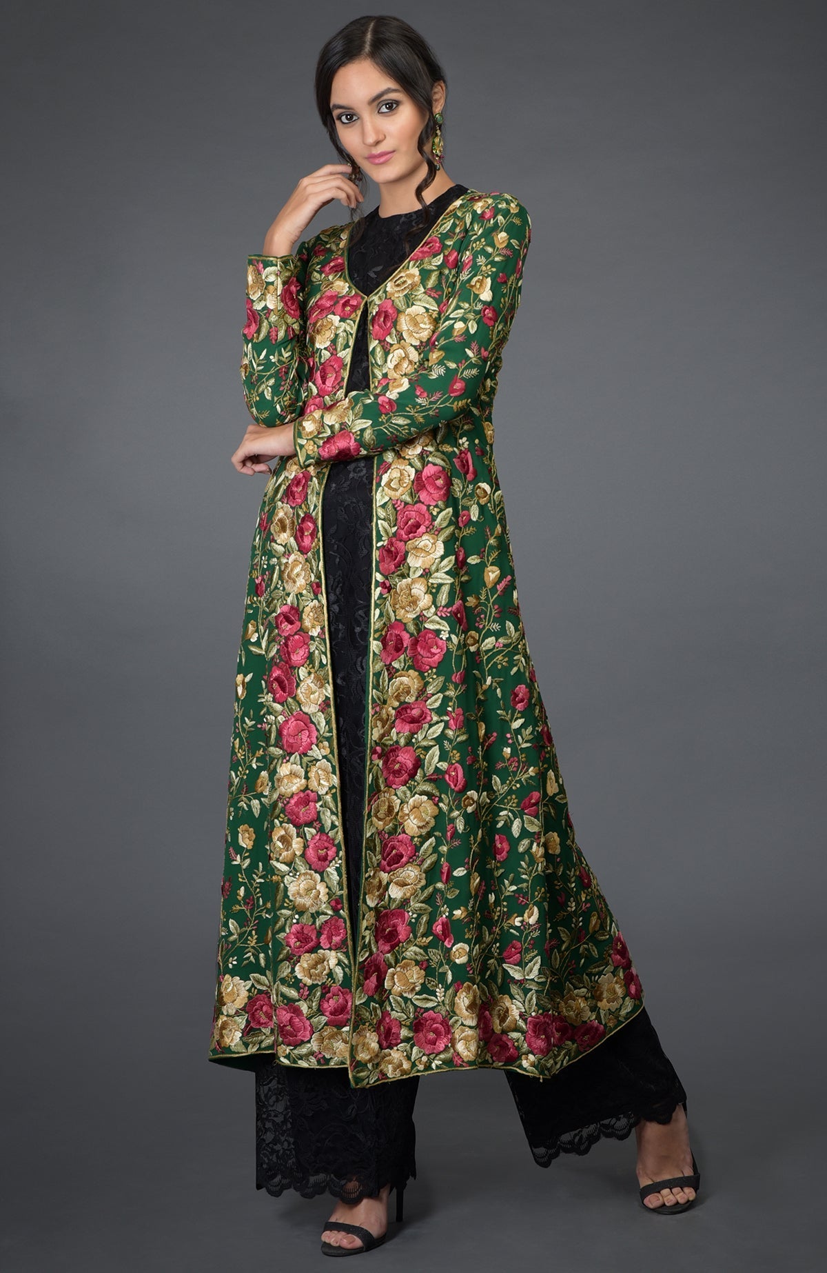 Emerald green georgette jacket with Parsi Gara floral embroidery and beige crepe flared skirt.