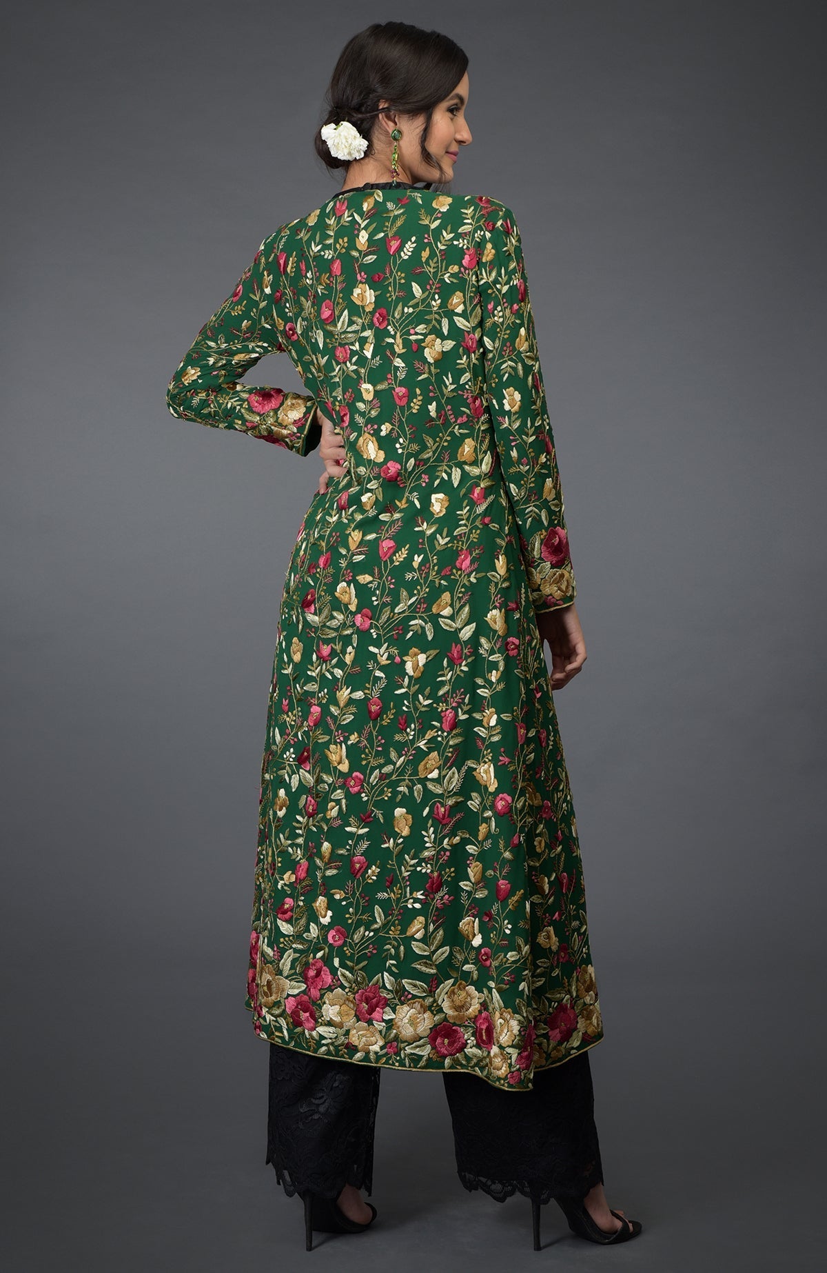 Emerald green georgette jacket with Parsi Gara floral embroidery and beige crepe flared skirt.